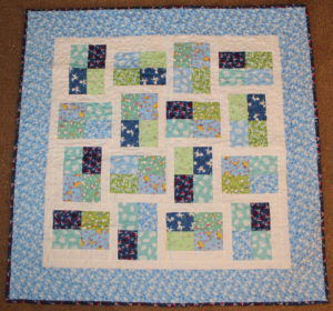 Pheobes Flower Box baby boy quilt using Toy Chest fabric line